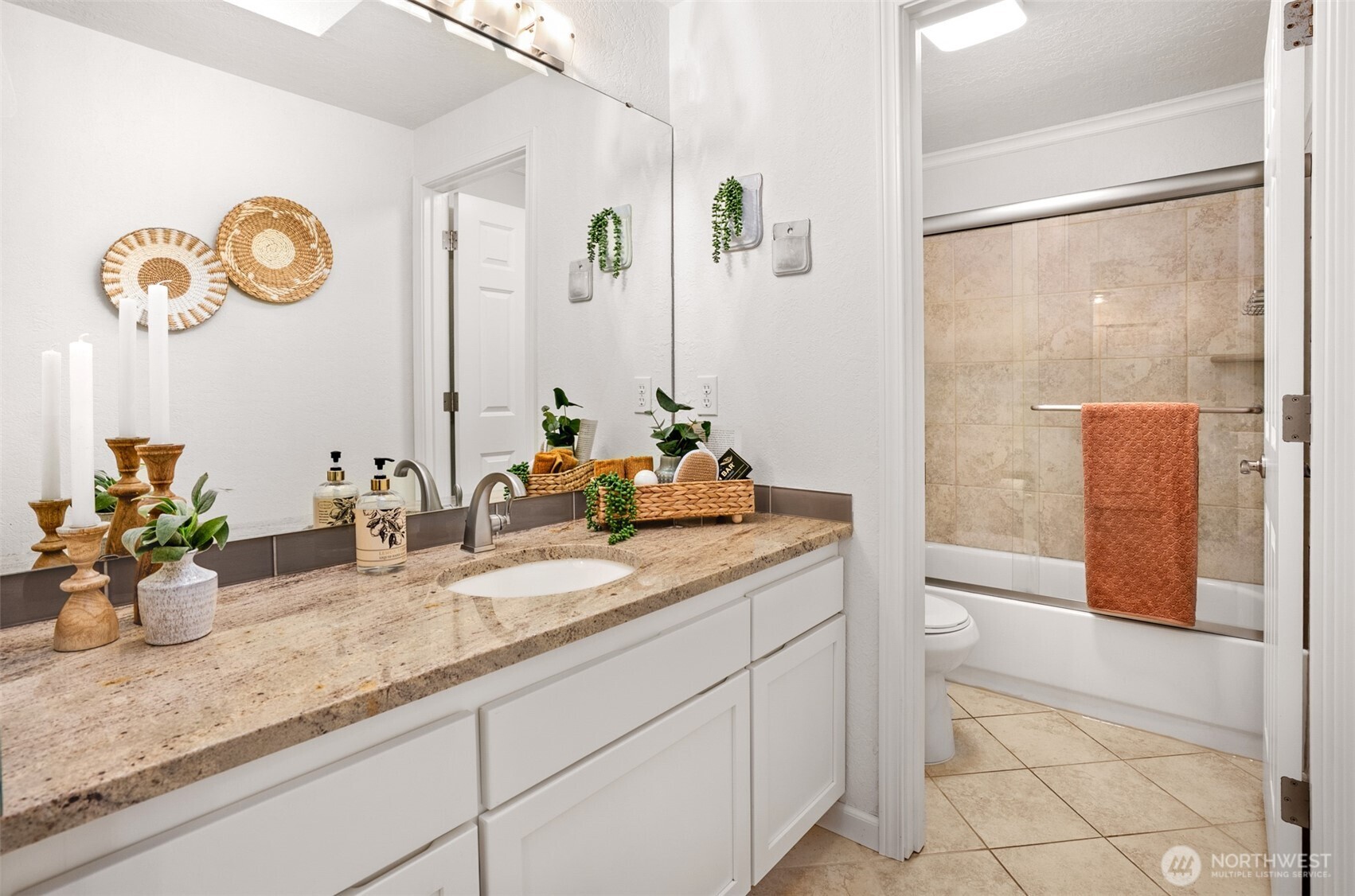 22709 12th Place West Bothell, WA 98021 - Photo 10 of 27 a bathroom with a granite countertop sink and a mirror