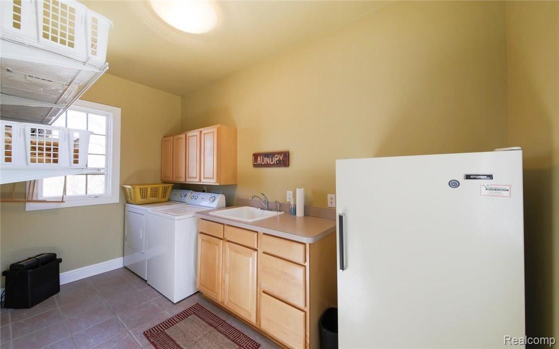 7990 Antcliff Road Howell, MI 48855 - Photo 33 of 51 Spacious laundry room.