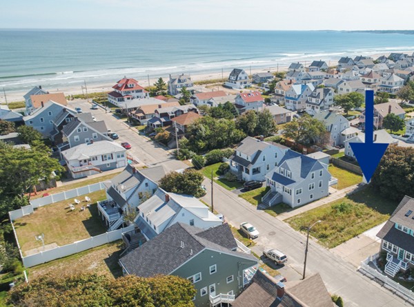an aerial view of a house with a ocean view