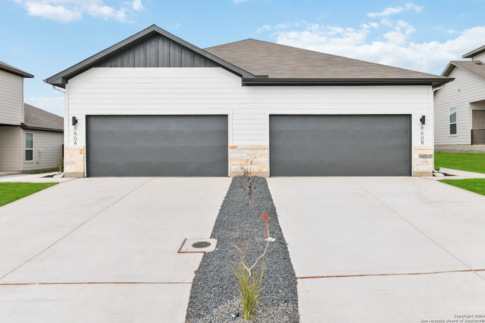 145 Schrader Drive Buda, TX 78610 - Photo 1 of 32 a front view of a house with a garage