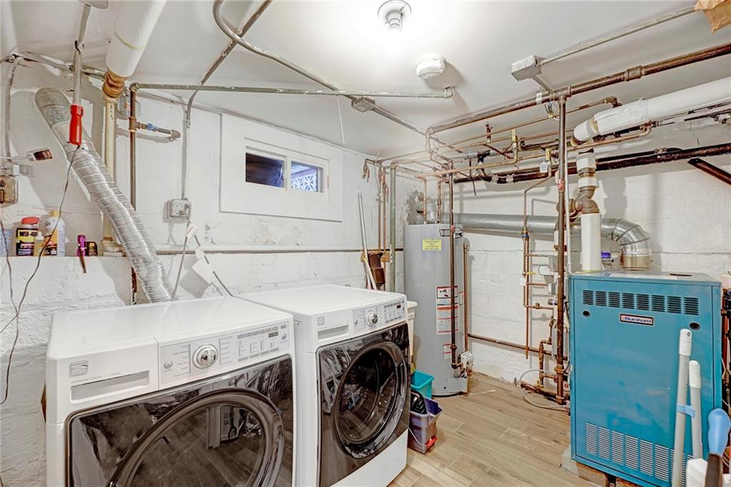 7607 Colonial Road Brooklyn, NY 11209 - Photo 29 of 35 a utility room with dryer and washer