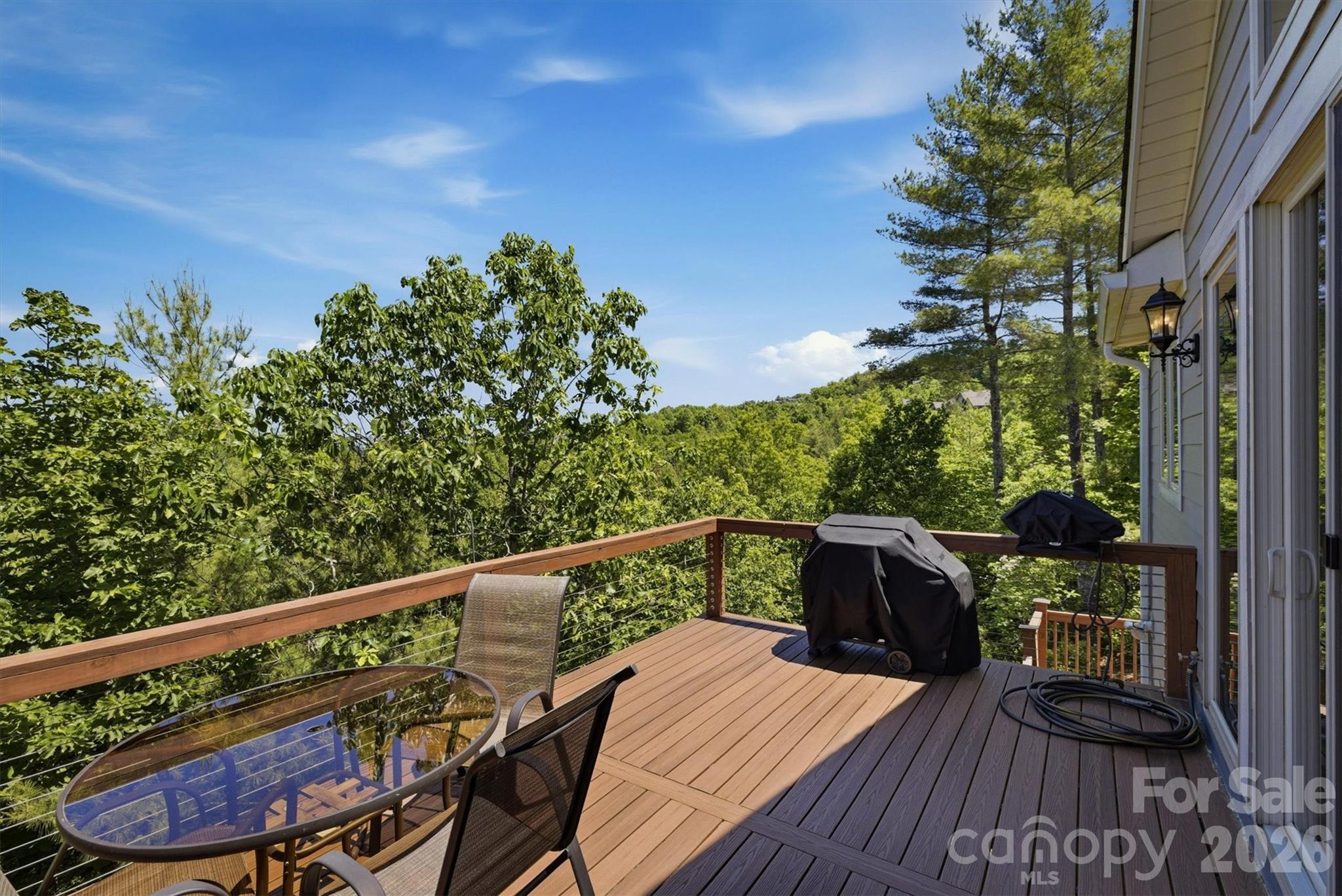 5564 Table View Lane Lenoir, NC 28645 - Photo 10 of 48 a balcony with wooden floor and outdoor seating