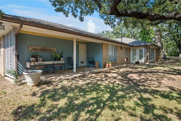 a view of a backyard with tree s