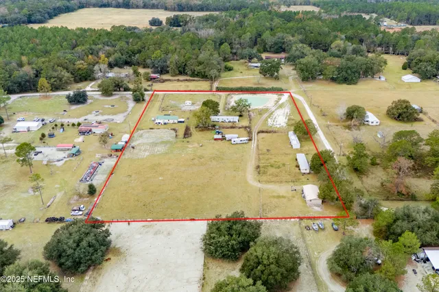 a view of a swimming pool with a yard