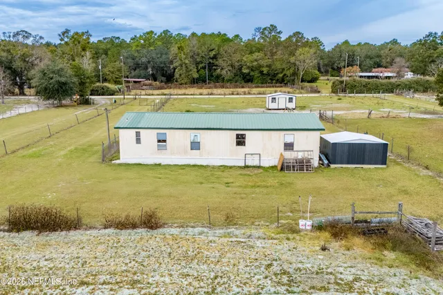 a view of a swimming pool and a yard