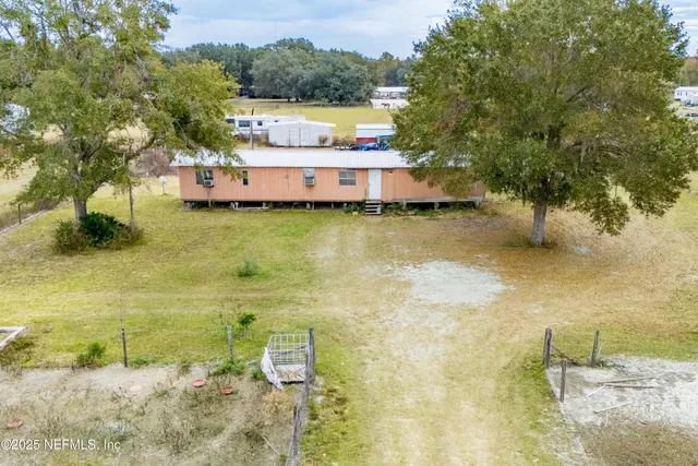 a swimming pool with trees in front of it