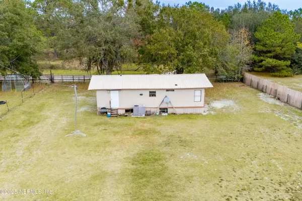 a view of a swimming pool with an outdoor space and seating area