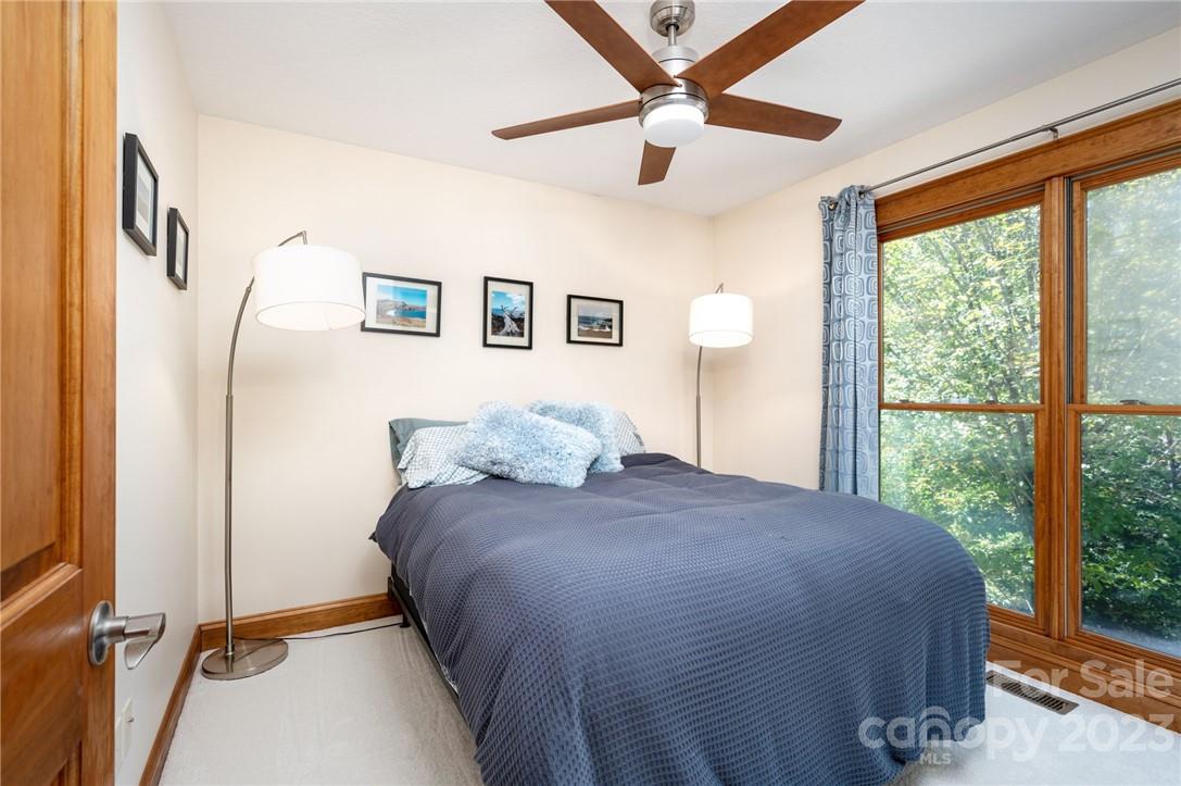 159 Deer Leap Marshall, NC 28753 - Photo 16 of 22 a bedroom with a large bed and a large window