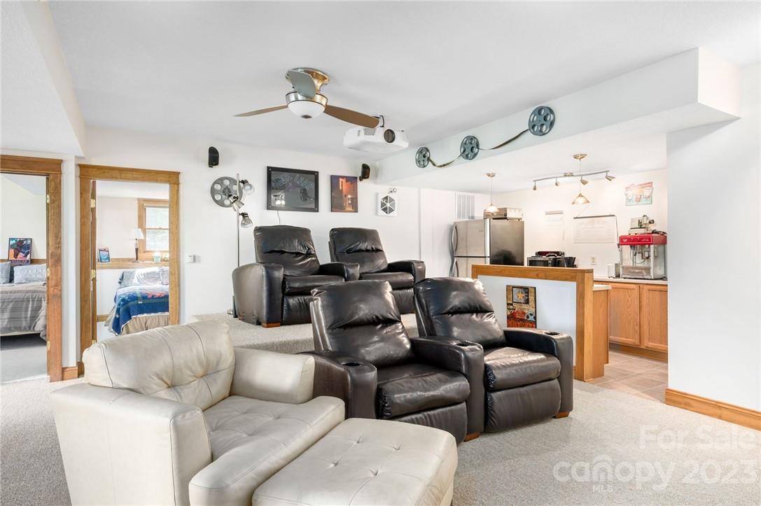 159 Deer Leap Marshall, NC 28753 - Photo 17 of 22 a living room with furniture kitchen view and a chandelier