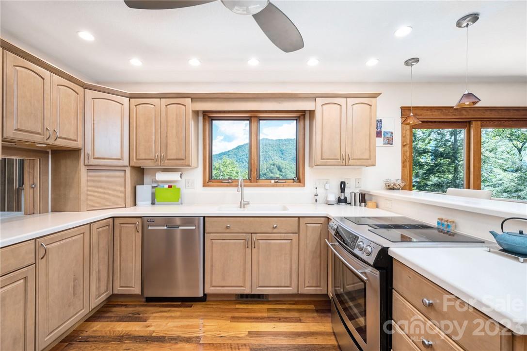 159 Deer Leap Marshall, NC 28753 - Photo 8 of 22 a kitchen with a sink window and cabinets