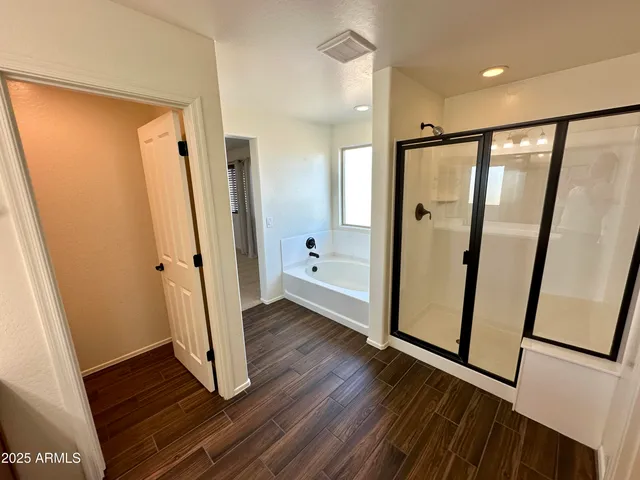 a view of front door and wooden floor