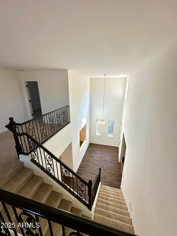 a view of a balcony with furniture