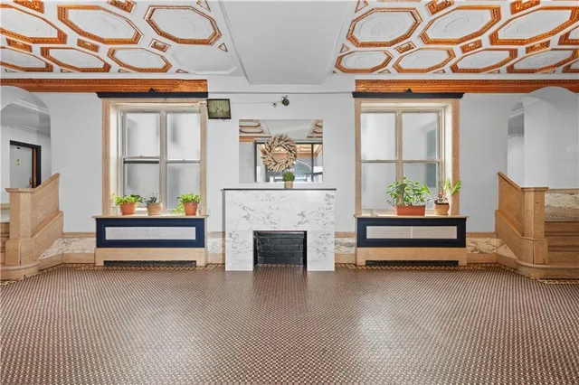 a bedroom with furniture and a fireplace