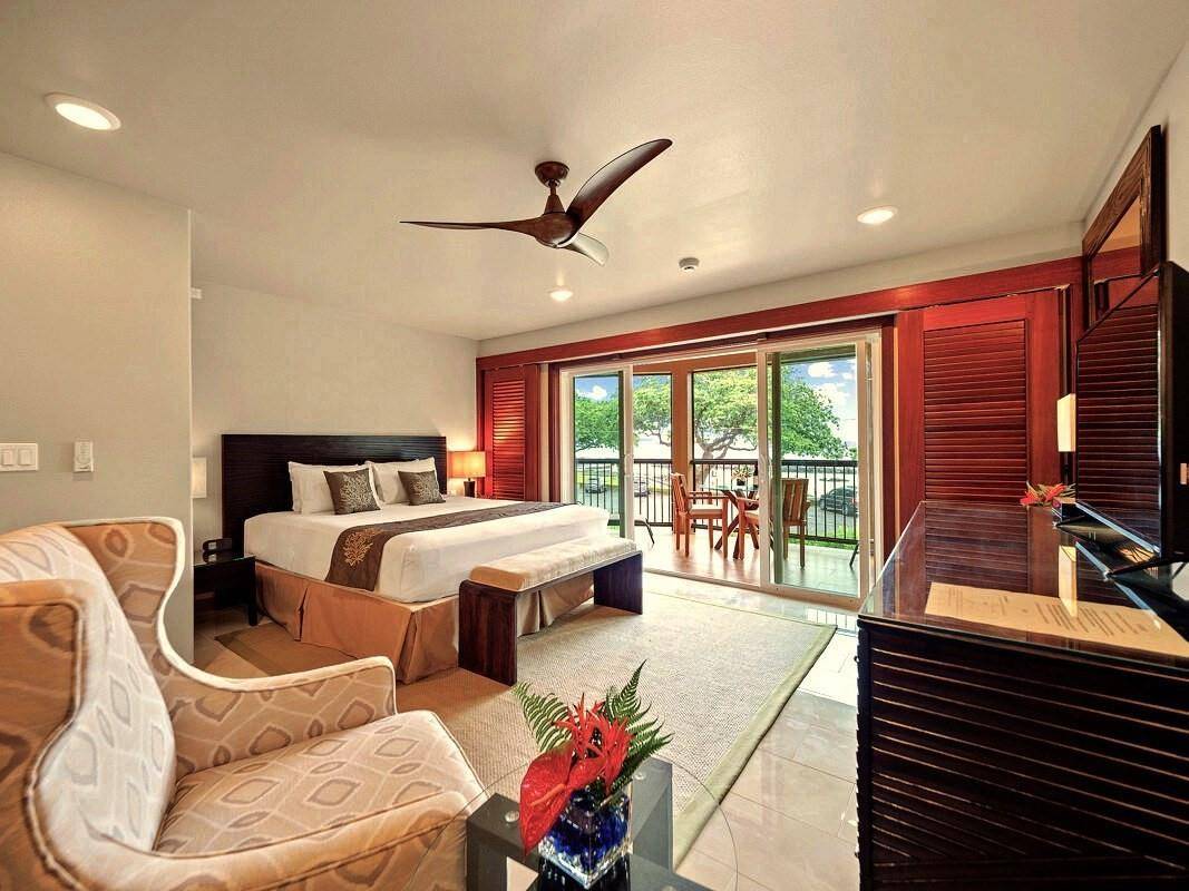 23 Machida Lane Hilo, HI 96720 - Photo 15 of 30 a bedroom with a bed and a large window