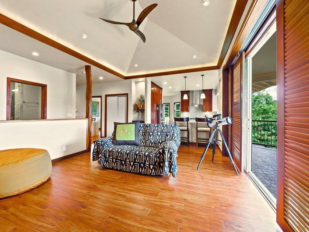 23 Machida Lane Hilo, HI 96720 - Photo 8 of 30 a living room with furniture and a table