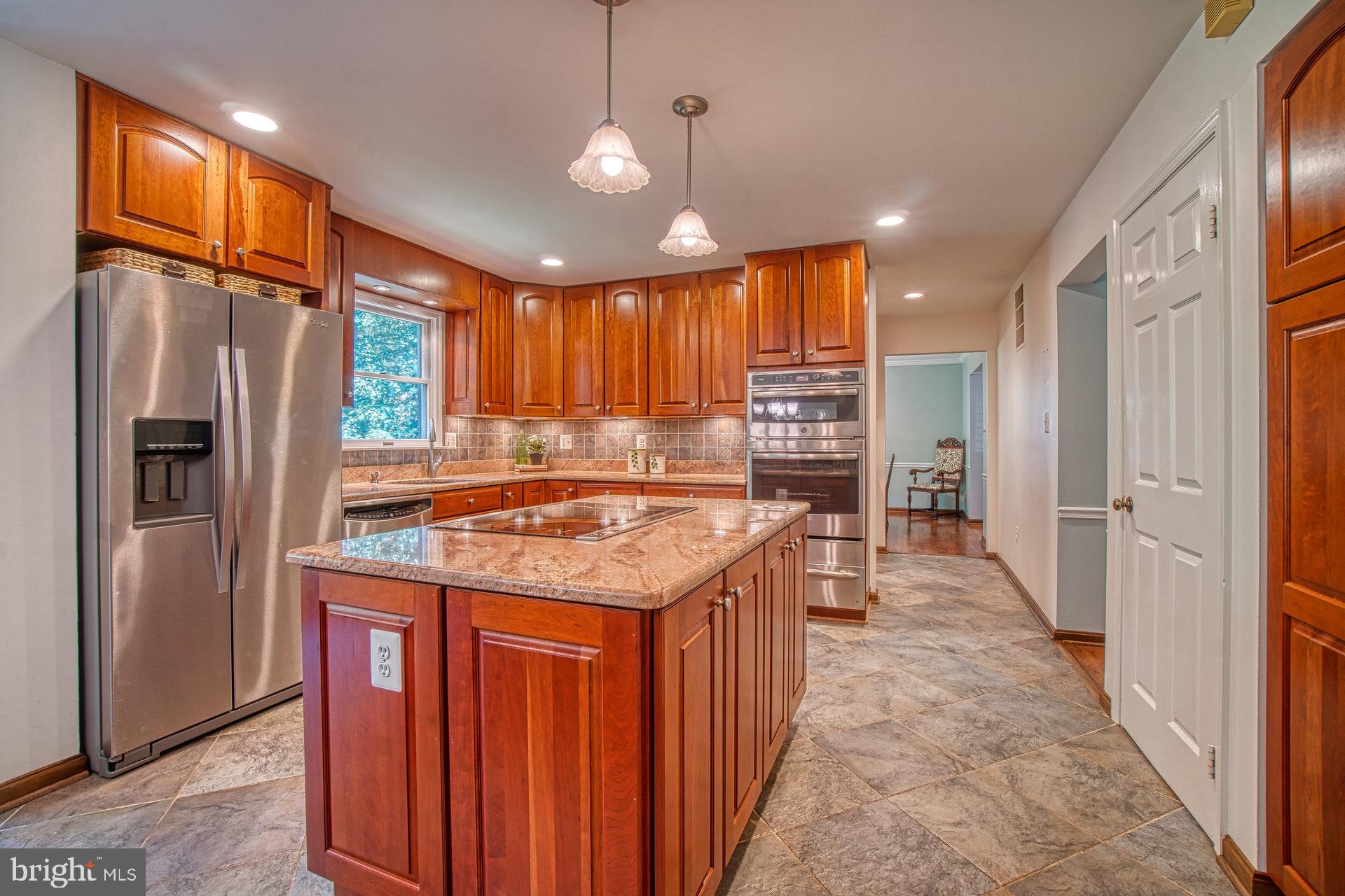 9312 Brian Run Lane Springfield, VA 22153 - Photo 10 of 42 Large island with glass cook-top & stainless steel
