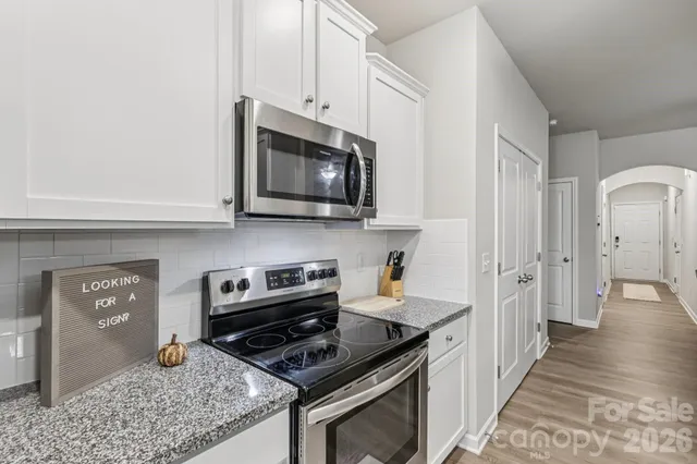a bathroom with a sink toilet and mirror