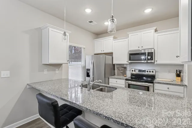 a bathroom with a sink and mirror