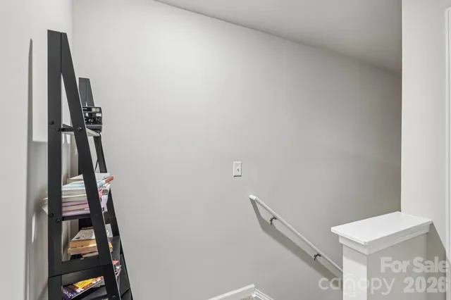 a bathroom with a sink vanity mirror and toilet