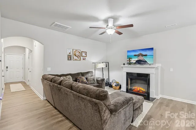 a view of a brick house with large windows