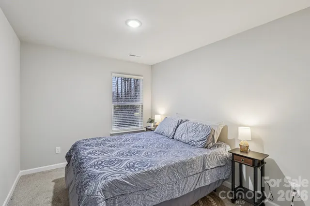 a bathroom with a toilet a sink and shower