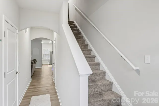 a living room with furniture and a ceiling fan