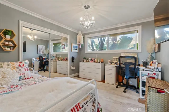 a bedroom with bed and window