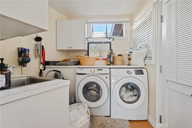 a view of kitchen sink and washer dryer