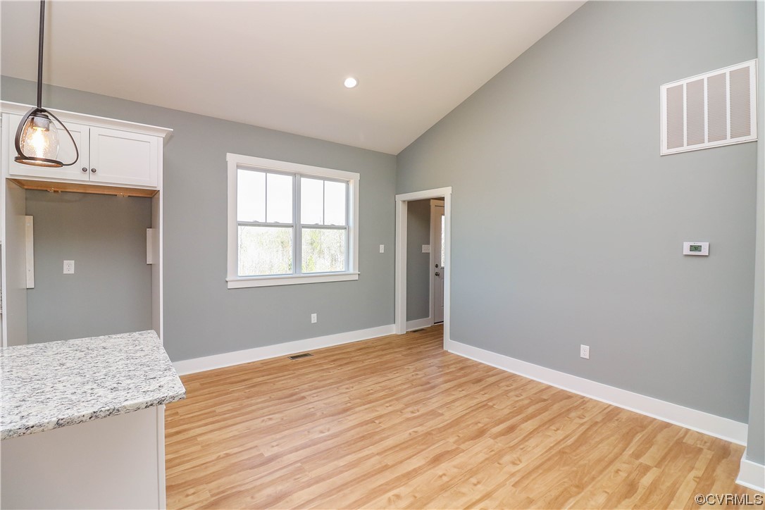 288 Moore Road Pamplin, VA 23958 - Photo 12 of 29 a view of an empty room with wooden floor and a window