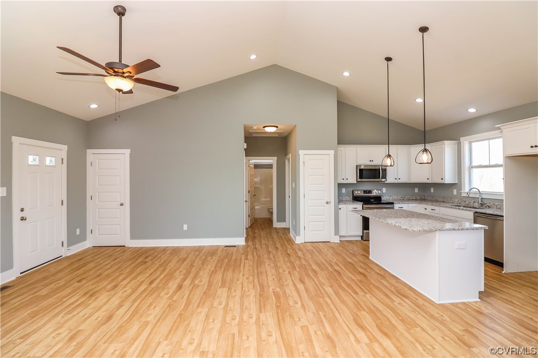288 Moore Road Pamplin, VA 23958 - Photo 17 of 29 a open kitchen with stainless steel appliances granite countertop a refrigerator a stove and white cabinets with wooden floor