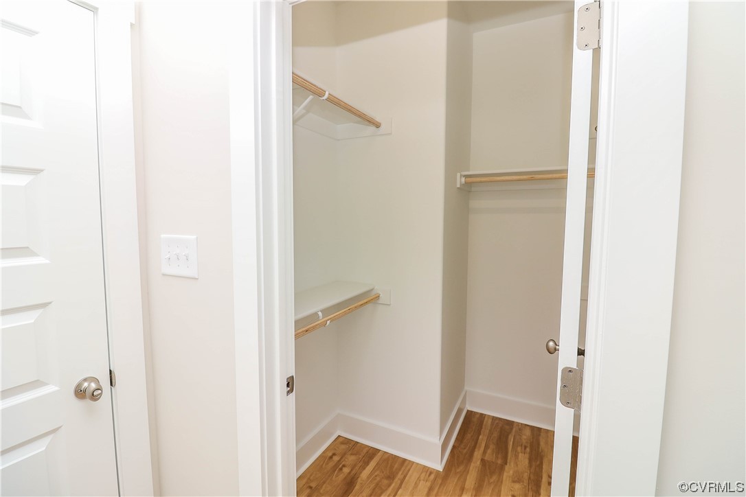 288 Moore Road Pamplin, VA 23958 - Photo 24 of 29 Walk in closet with wood-type flooring