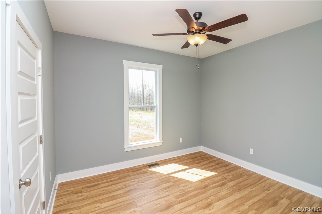 288 Moore Road Pamplin, VA 23958 - Photo 25 of 29 an empty room with window and ceiling fan