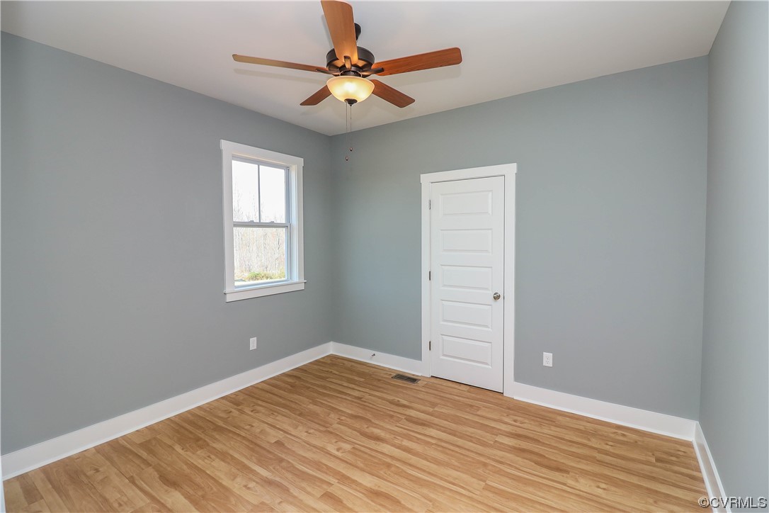 288 Moore Road Pamplin, VA 23958 - Photo 27 of 29 wooden floor in an empty room with a window