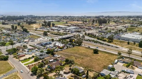 an aerial view of residential house with outdoor space and mountain view