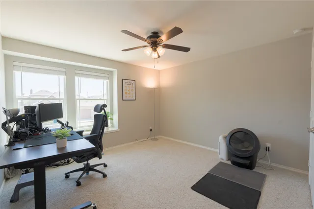 an aerial view of a house with garden space and lake view