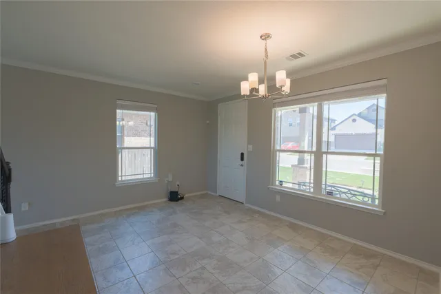 an entryway and livingroom with furniture