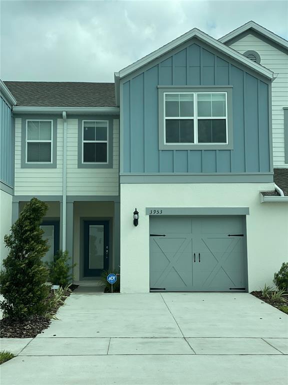 3953 Plainview Drive Orlando, FL 32824 - Photo 1 of 1 a front view of a house with a garage and balcony