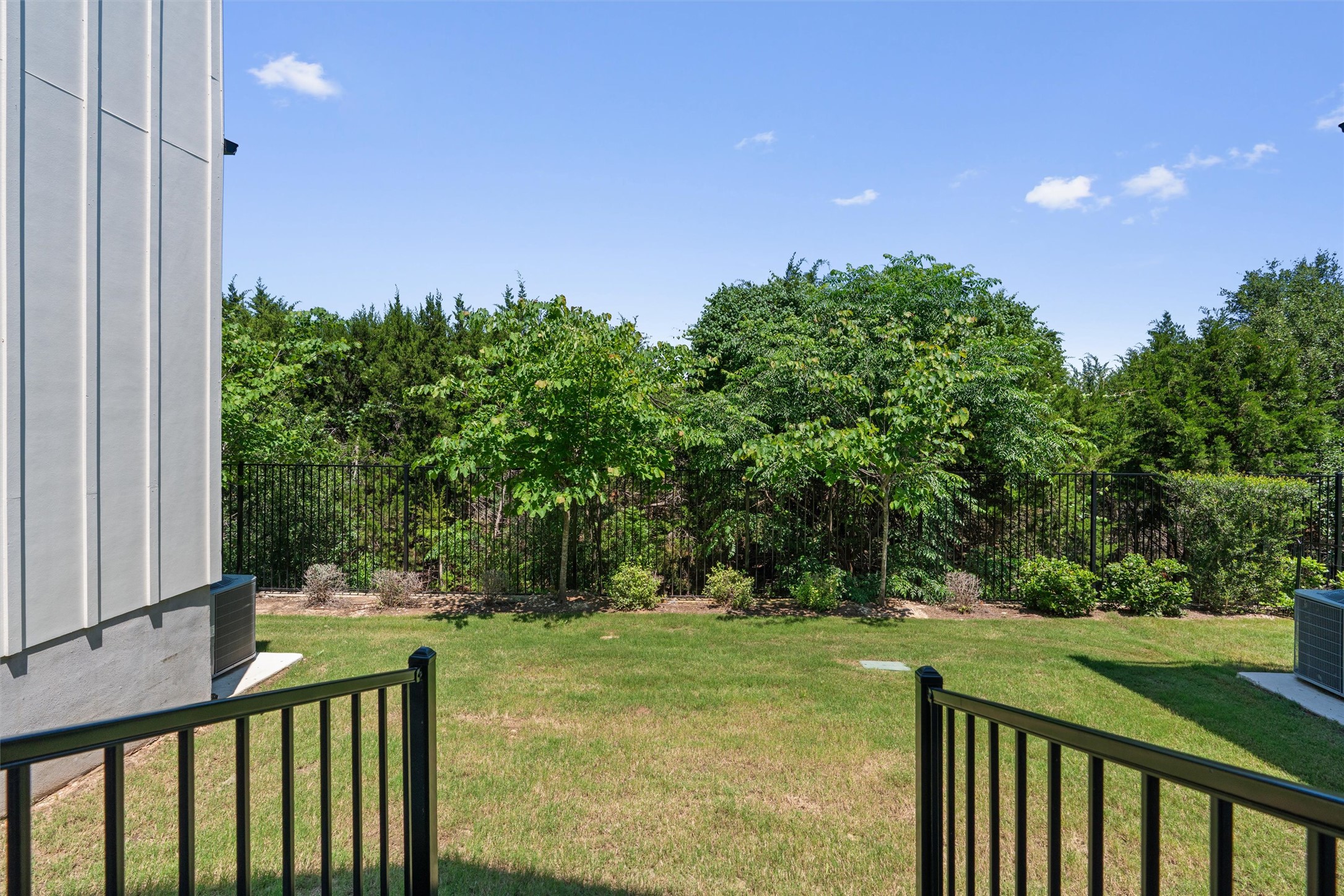 590 Old Mill Road, Unit 153 Cedar Park, TX 78613 - Photo 25 of 40 a balcony with trees in front of it
