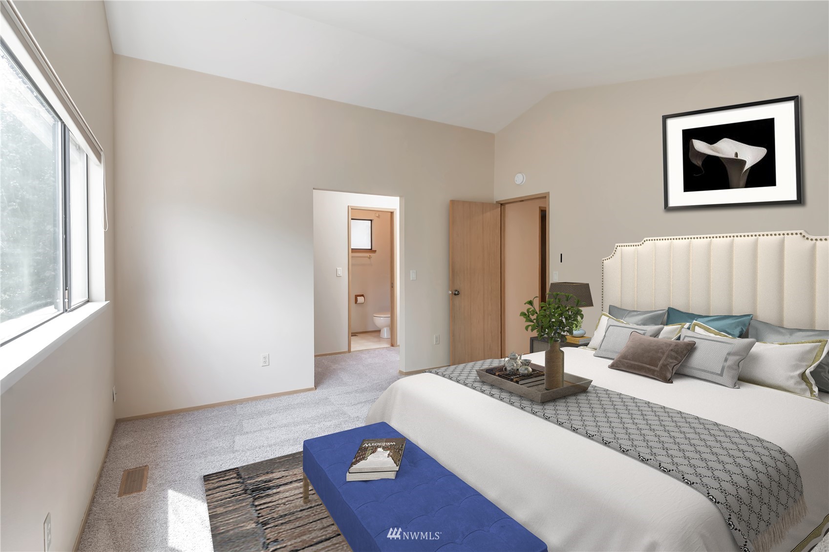 18221 26th Drive Southeast Bothell, WA 98012 - Photo 11 of 25 a bedroom with a bed and a painting on the wall