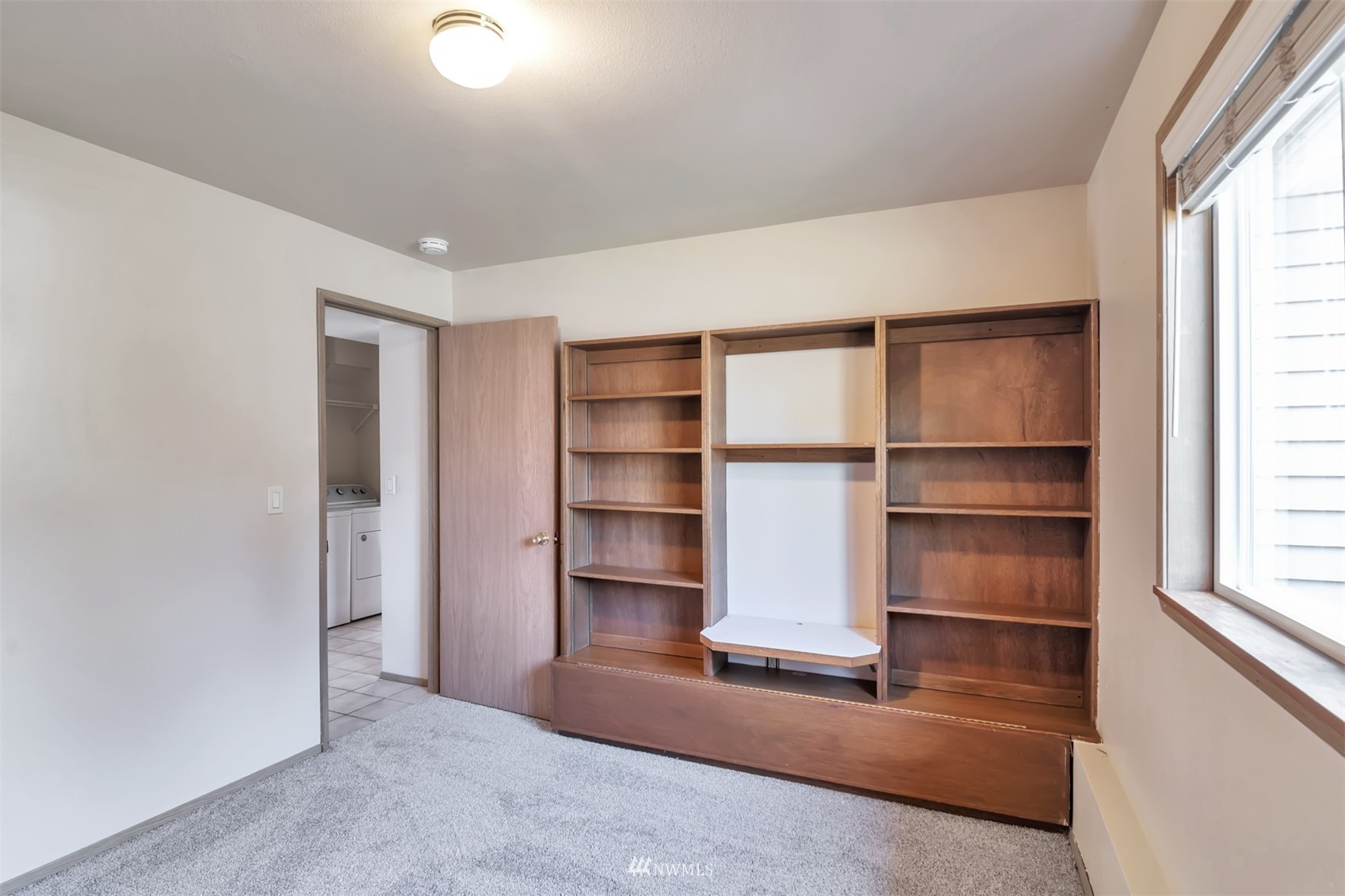 18221 26th Drive Southeast Bothell, WA 98012 - Photo 18 of 25 a living room with a furniture and a window