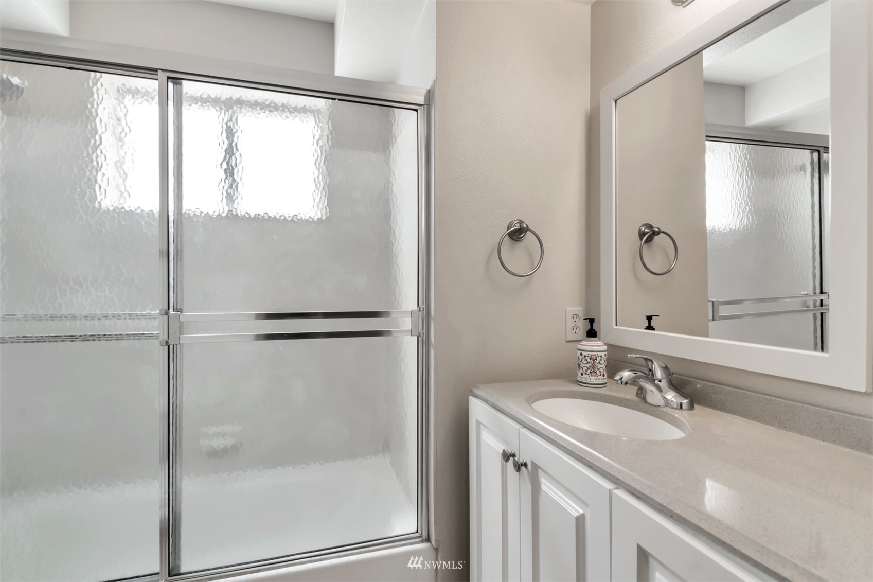 18221 26th Drive Southeast Bothell, WA 98012 - Photo 19 of 25 a bathroom with a granite countertop shower sink vanity and mirror