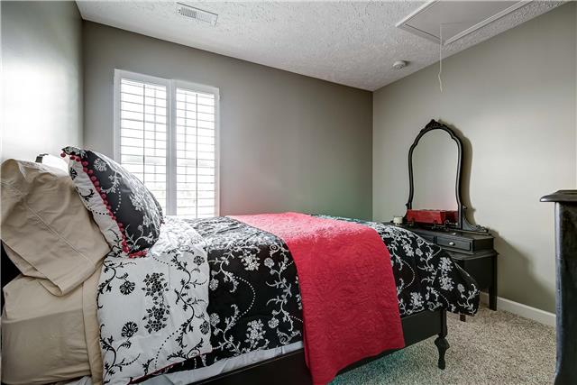 4011 Timber Ridge Court Mount Juliet, TN 37122 - Photo 14 of 20 a bedroom with a bed and a window