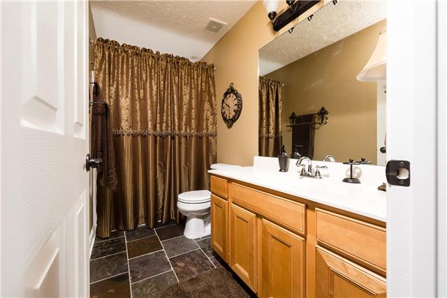 4011 Timber Ridge Court Mount Juliet, TN 37122 - Photo 16 of 20 a bathroom with a sink a toilet and shower