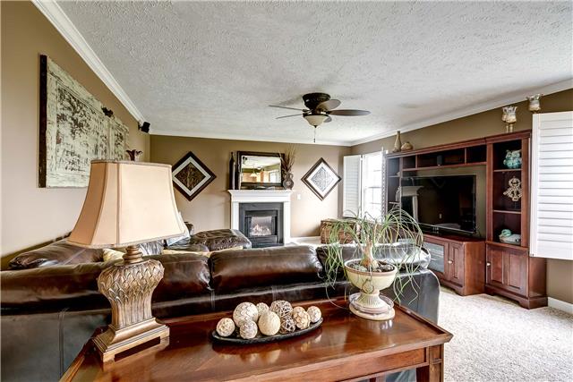4011 Timber Ridge Court Mount Juliet, TN 37122 - Photo 8 of 20 a living room with furniture and a flat screen tv