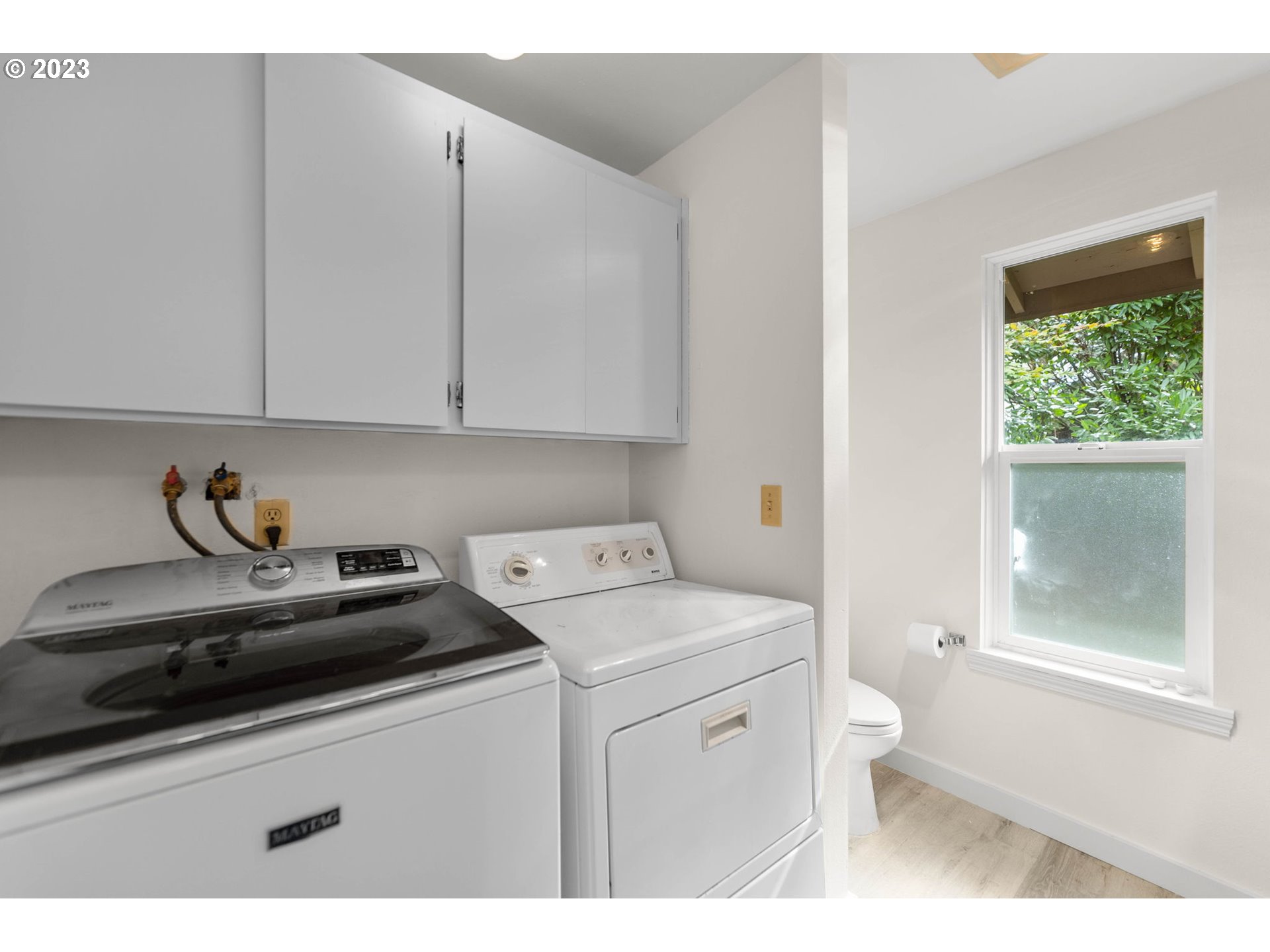 11856 Southeast Morrison Street Portland, OR 97216 - Photo 19 of 26 a utility room with sink dryer and washer