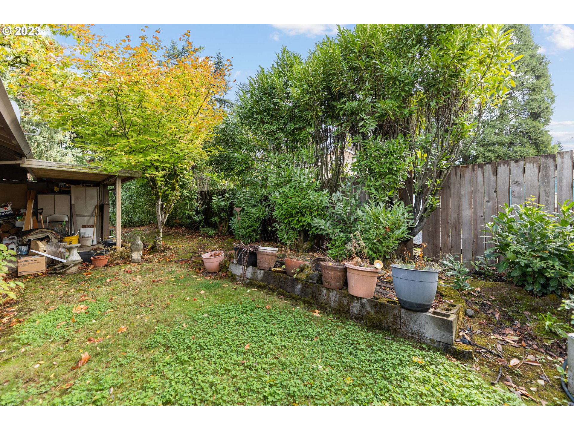 11856 Southeast Morrison Street Portland, OR 97216 - Photo 23 of 26 a view of a backyard with plants and a patio