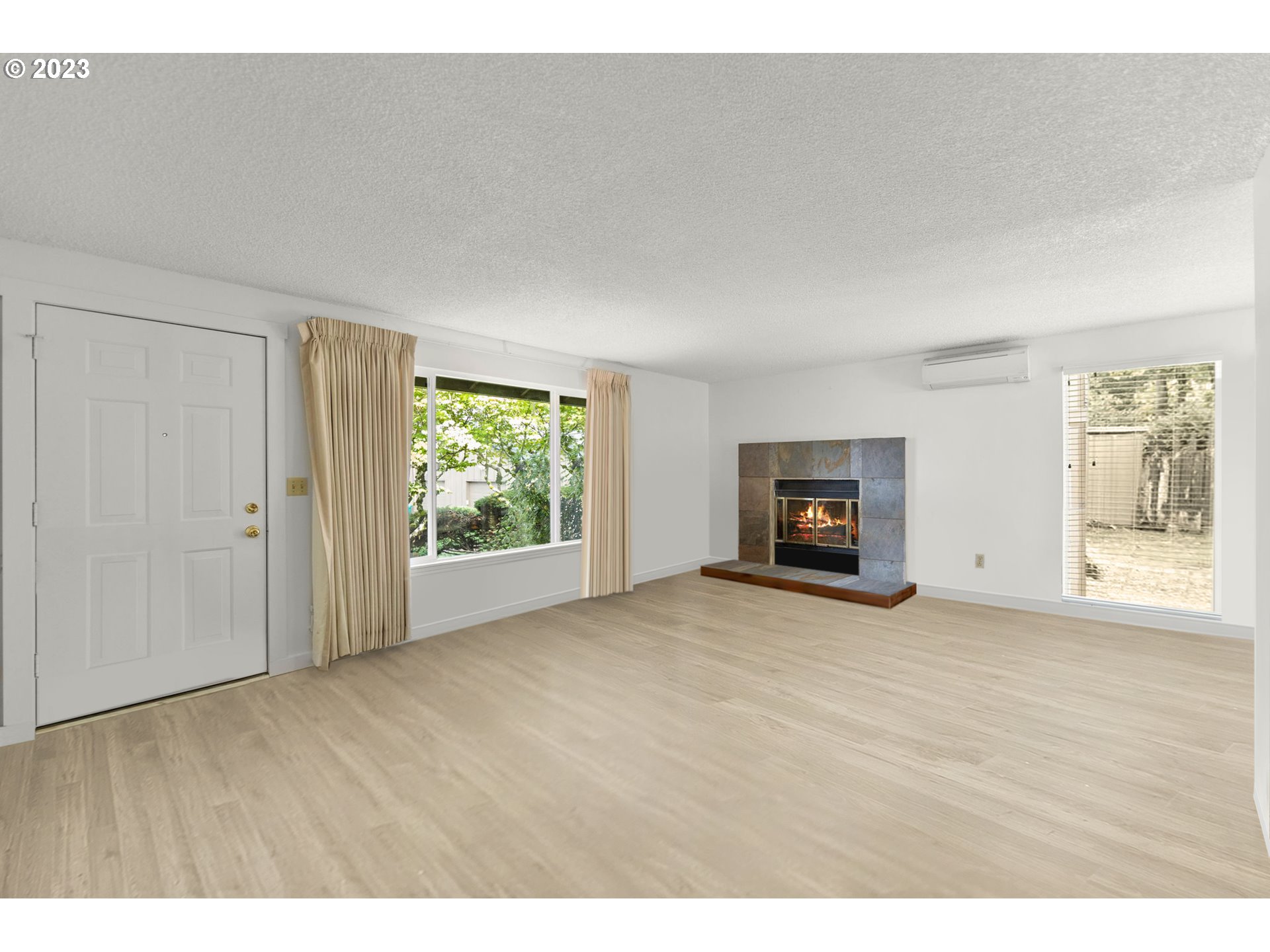 11856 Southeast Morrison Street Portland, OR 97216 - Photo 5 of 26 a view of empty room with wooden floor and window