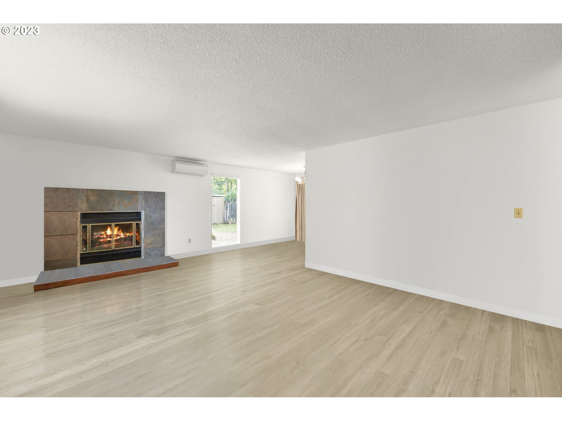 11856 Southeast Morrison Street Portland, OR 97216 - Photo 6 of 26 a view of an empty room and a fireplace