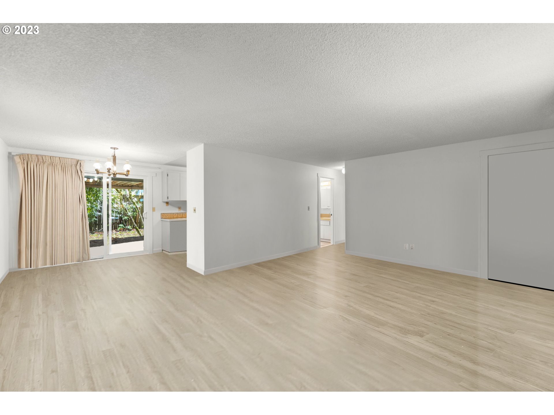 11856 Southeast Morrison Street Portland, OR 97216 - Photo 8 of 26 a view of an empty room with a window