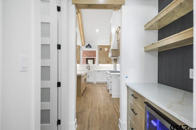 a view of a kitchen from the hallway